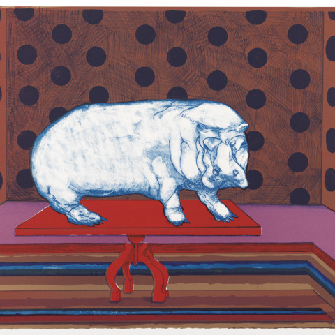 A white hippopotamus stands atop a red table in a room with dark polka-dotted walls and a multi-colored striped floor
