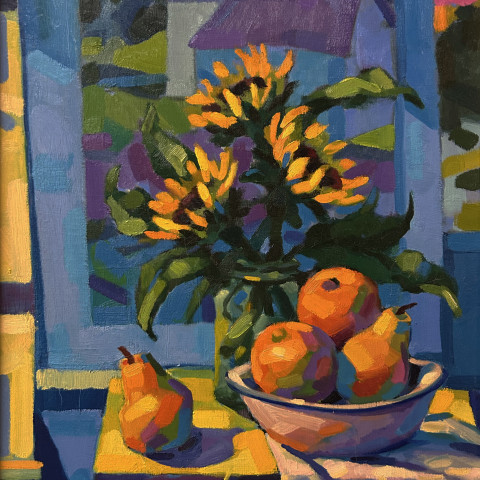 A vibrant Fauvist-style still life painting depicting a vase of bright yellow sunflowers and a bowl of oranges and pears on a table in front of a blue-framed window overlooking a colorful landscape.