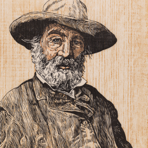 A detailed, three-color woodcut print depicts a half-length portrait of the elderly American poet Walt Whitman wearing a wide-brimmed hat and an overcoat, set against a light-colored background that prominently showcases a vertical woodblock grain texture.