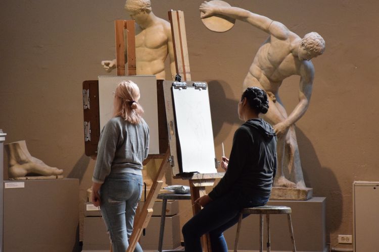 Two students drawing in the Cast Hall