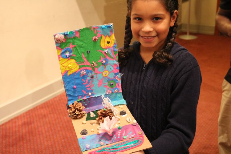 Camper showing her work