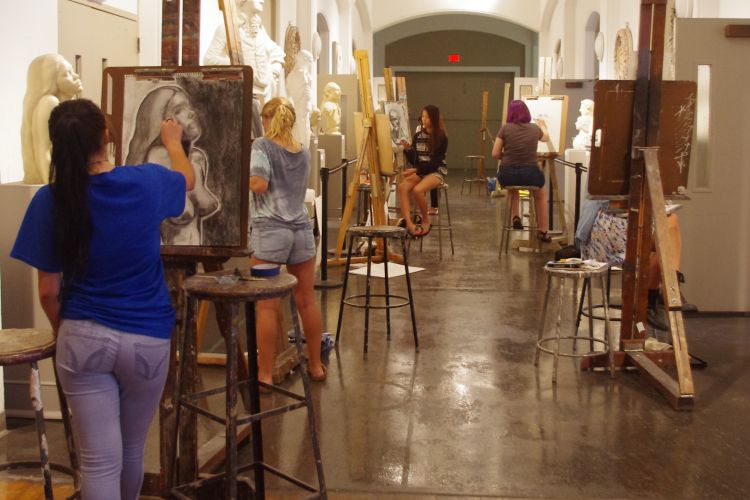 Students draw in cast hall