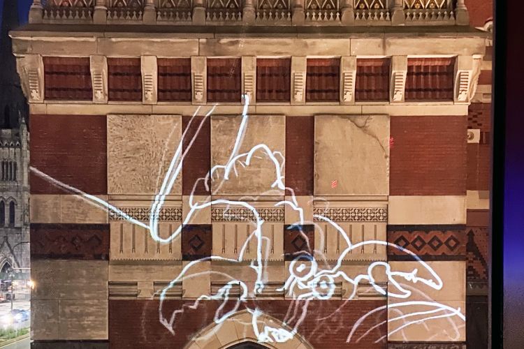 screengrab of the Philadelphia Animation Ensemble projected onto the Historic Landmark building