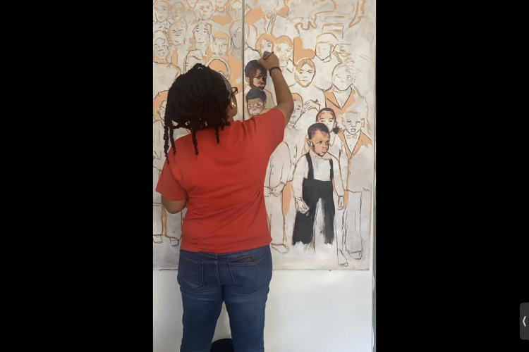 Athena Scott with back turned works on large painting of figures