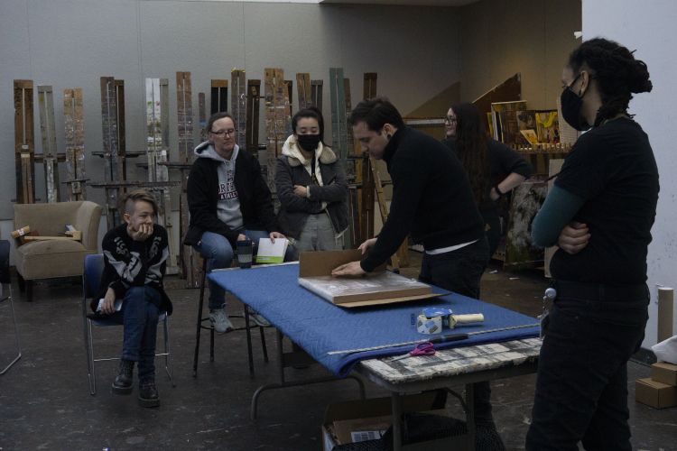 Students learning how to install their work in preparation for the Annual Student Exhibition.