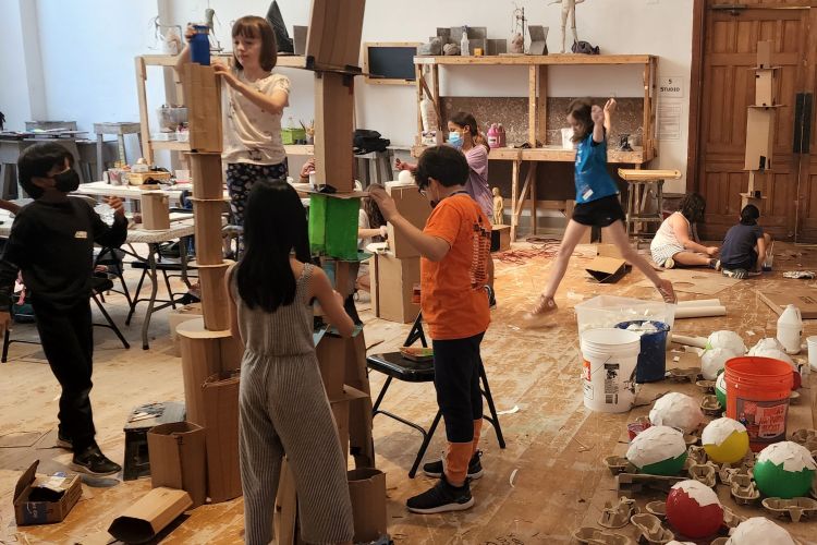 Children building sculpture together
