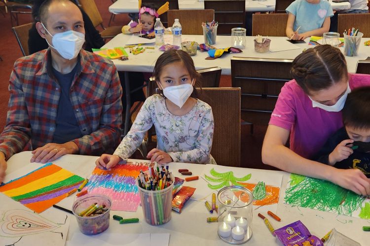 family working on their colorful art project
