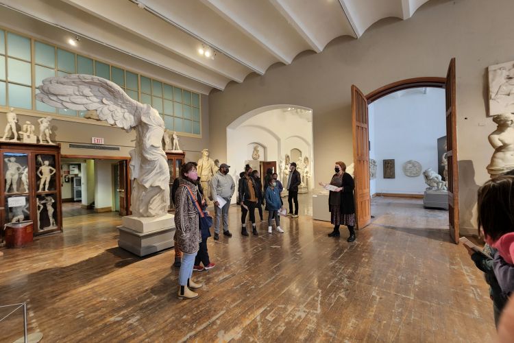 families in cast hall looking around