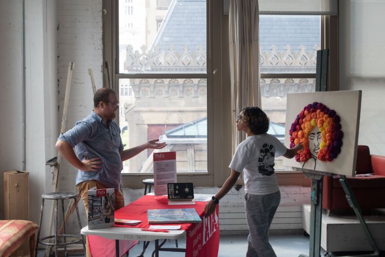 admissions staff talking with student