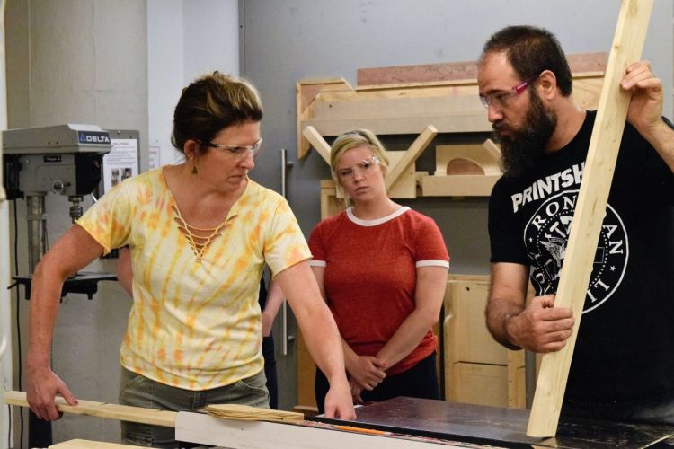John Greig with others working.