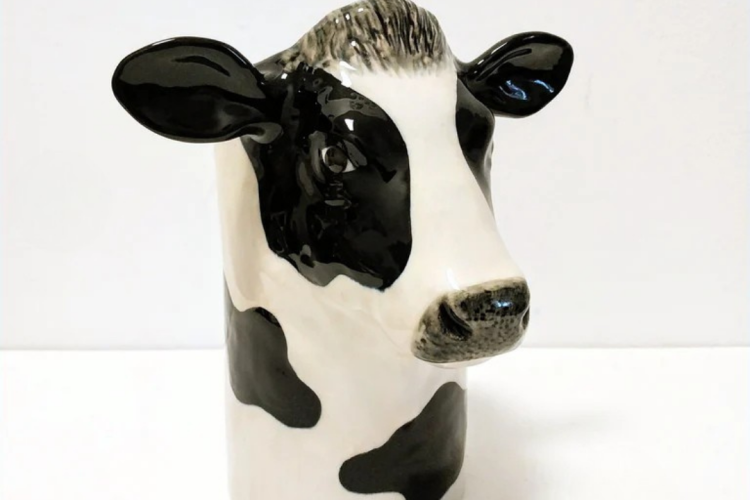 Ceramic Utensil Holder that looks like a cow.