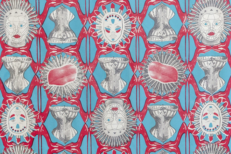 A vibrant repeating textile pattern in red, cyan, and off-white shows interlocking geometric motifs with stylized human faces featuring red lips and spiky halo-like hair, gray corset- or armor-like forms, and circular sunburst shapes with pink, organic-looking centers.
